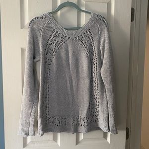 Gray sweater with crochet pattern